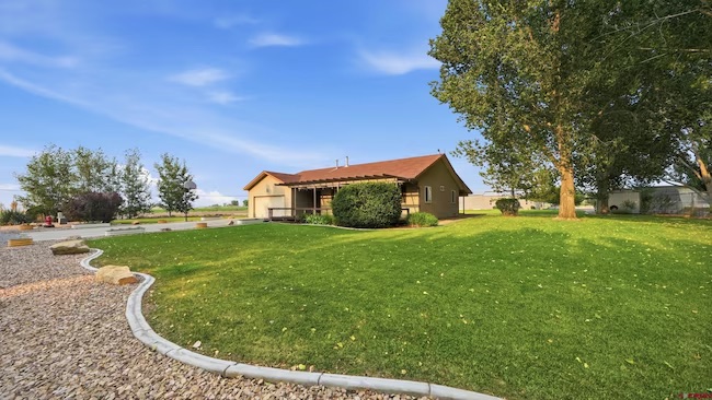4024 5945 Rd, Olathe — mid-century modern home on an acre with mature landscaping